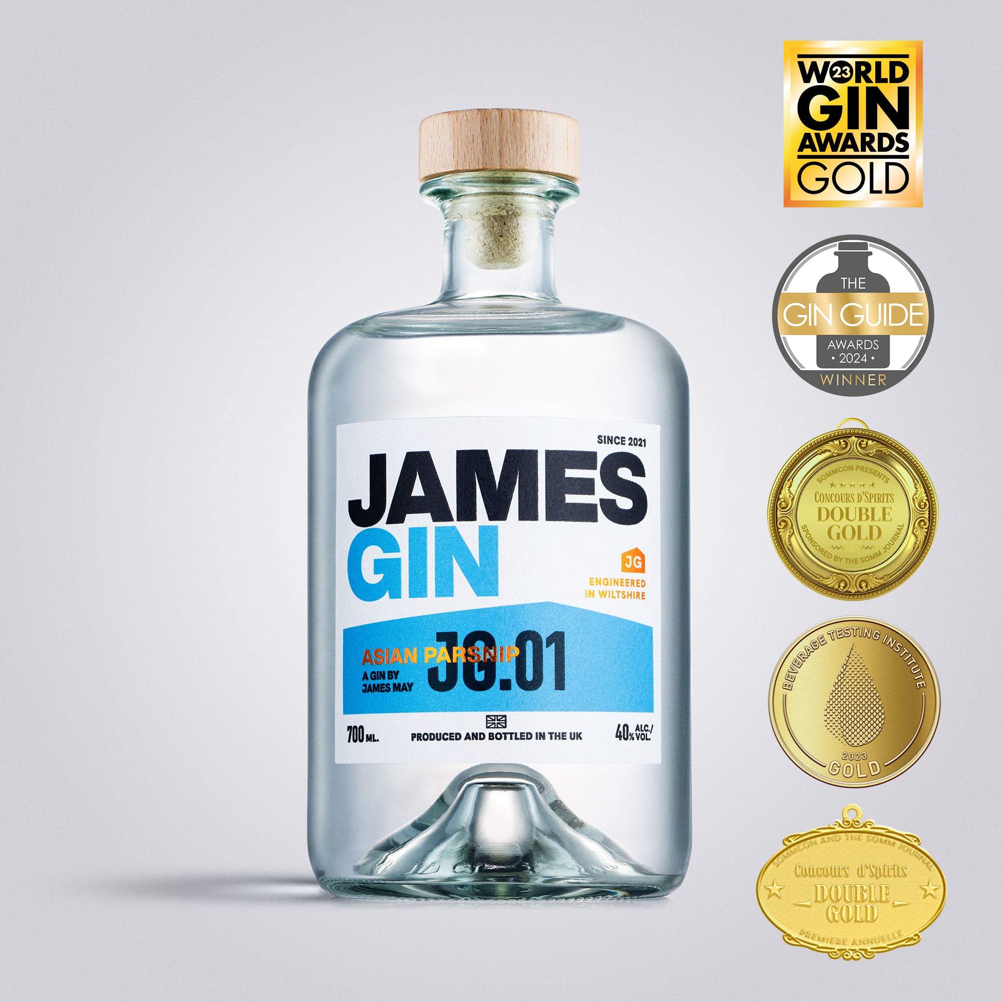 Bottle of James Gin with gold awards on a light gray background