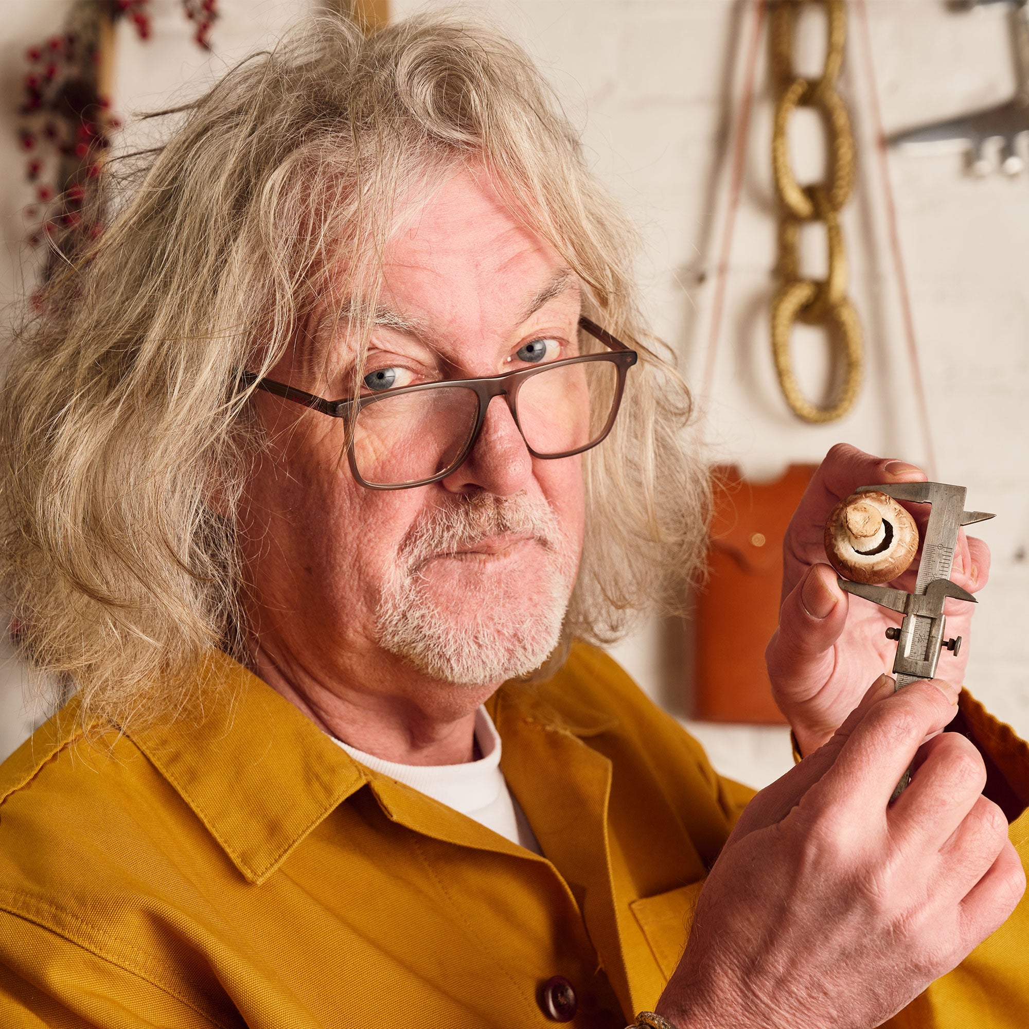 James May with callipers and a Mushroom - a key ingredient in his James Gin California Dreamgin'